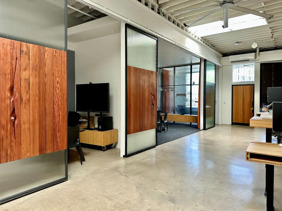 DBA_OAK sliding doors separating the conference room.