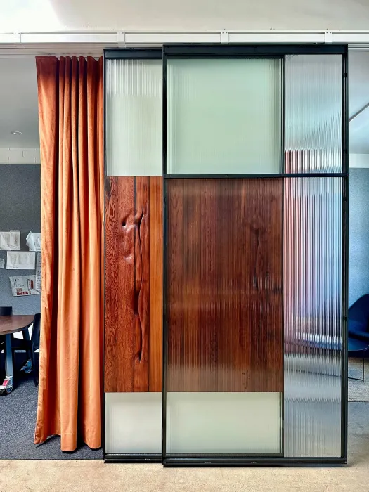 DBA_OAK sliding doors separating the conference room and storefront.