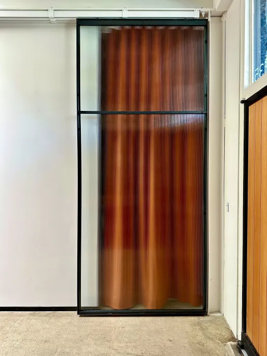 DBA_OAK sliding doors separating the storefront lounge.