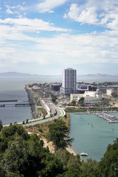 Exterior view of Isle House on Treasure Island with the San Francisco bay in the background.