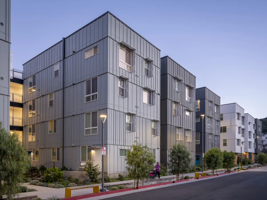 Exterior street view at dusk of 88 Park Street at Midway Village.