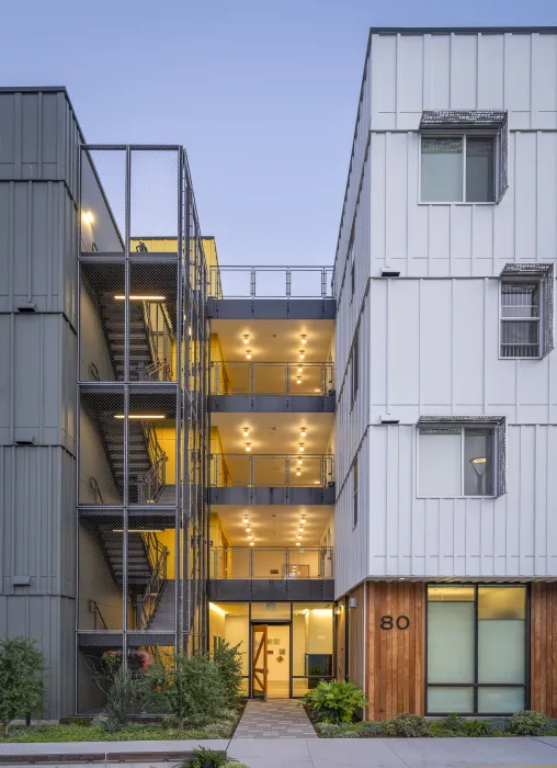 Exterior view of the entry to 88 Park Street at Midway Village at dusk.