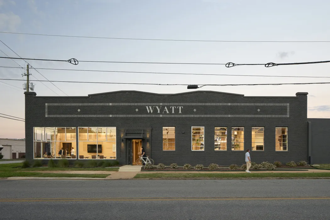 Exterior street view of Wyatt Builds at dusk.