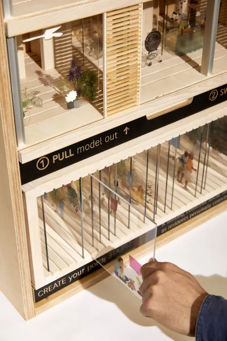 Product photography of architectural model, detail showing interaction