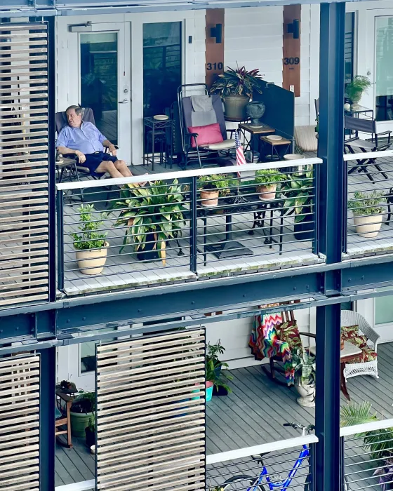 A cutaway view of the stacked porches showing personal touches added by residents