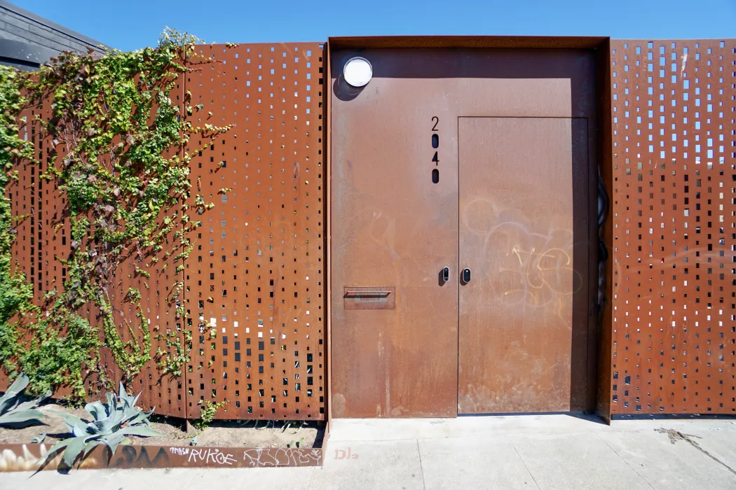 Cor-ten fence around the DBA_OAK courtyard.