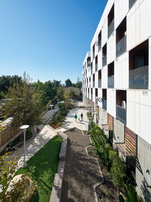 View from above of landscaped courtyard at white apartment building