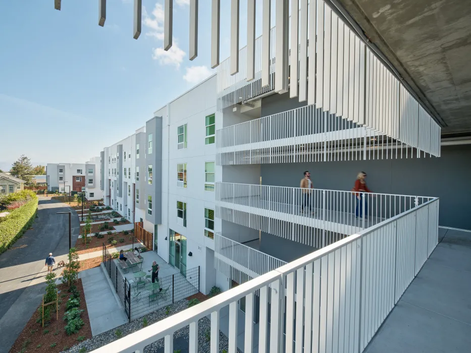 View from exterior hallway showing view down adjacent bike path