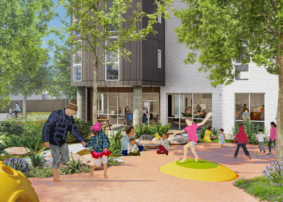 Children playing on paved ground in front of gray and white building