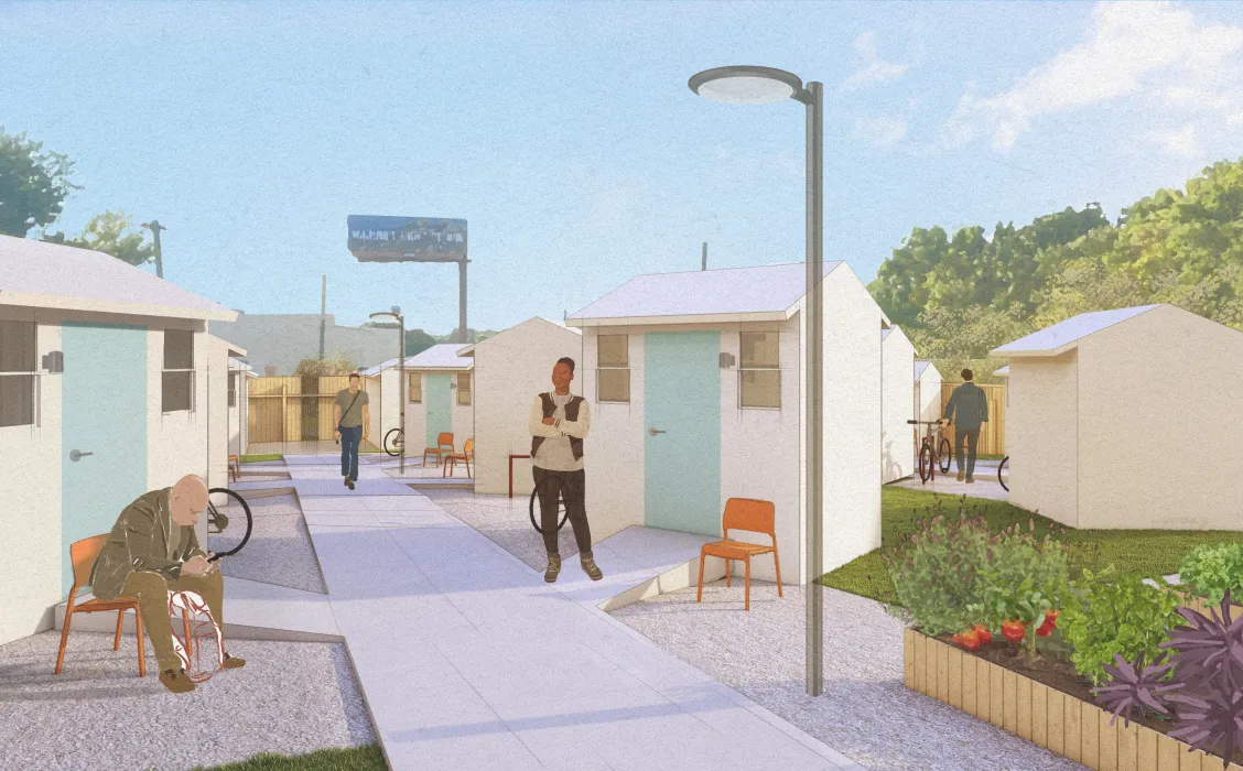 Man standing in front of small building