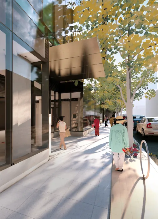 Building entrance canopy and sidewalk with tree and people