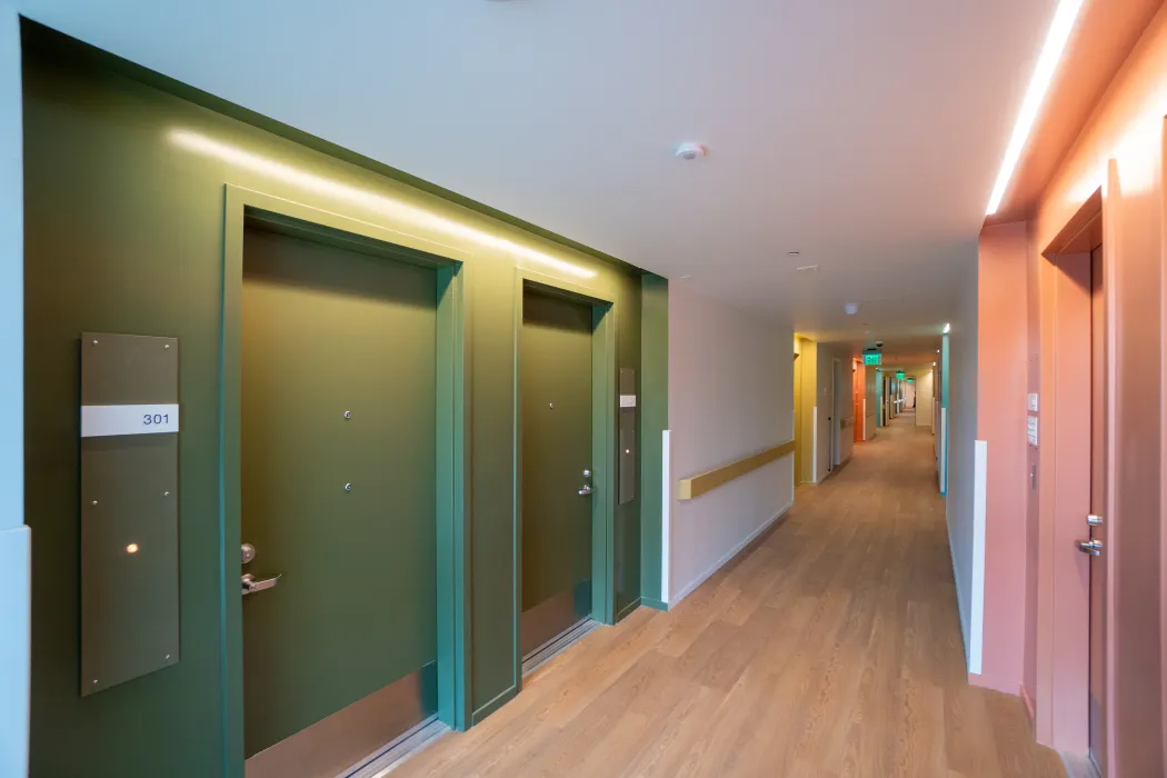 Bold colors in interior hallways support intuitive navigation