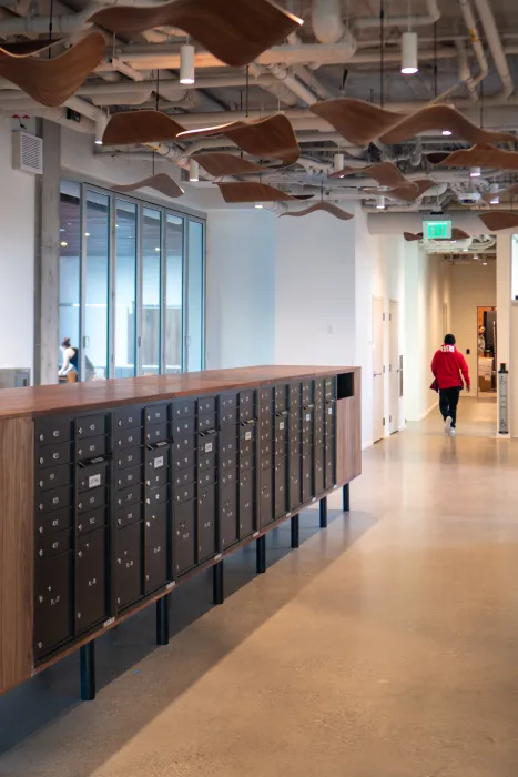 Common area with mail center and pedestrian in background