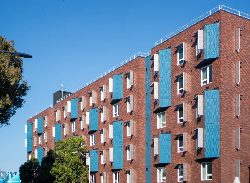 Blue brick accents enliven a red-brick facade