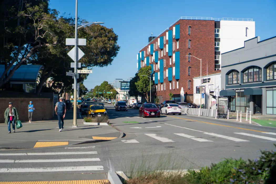 View of apartment building in neighborhood context