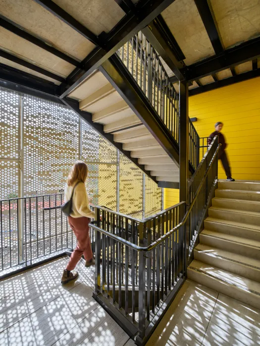 Stairwell with perforated metal and filtered light