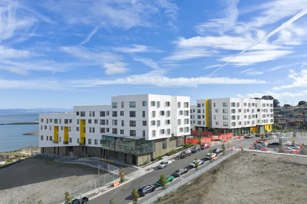 Aerial view showing apartment buildings and water's edge
