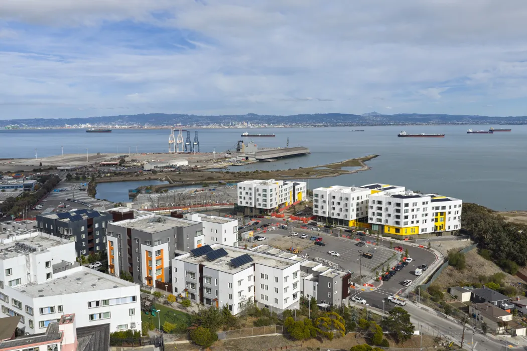 Aerial view showing apartment buildings and water's edge
