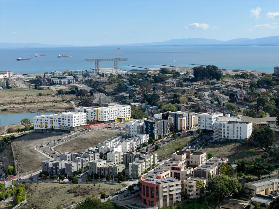 Aerial view showing apartment buildings and water's edge