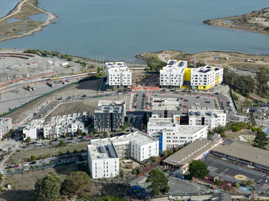 Aerial view showing apartment buildings and water's edge