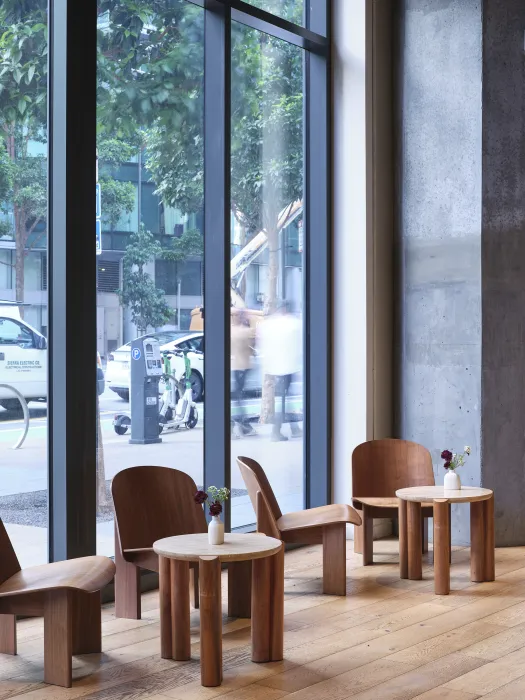 Floor to ceiling windows make up a wall of the coffee shop