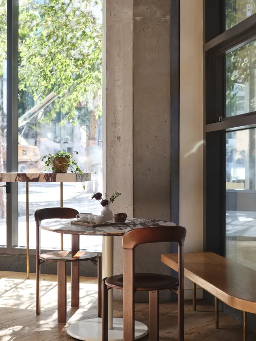 Daylight streans into the shop from the floor to ceiling windows