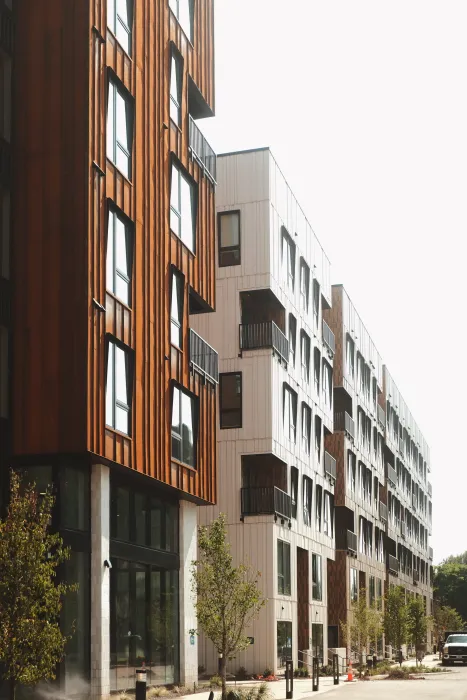 Rust and white building with sidewalk