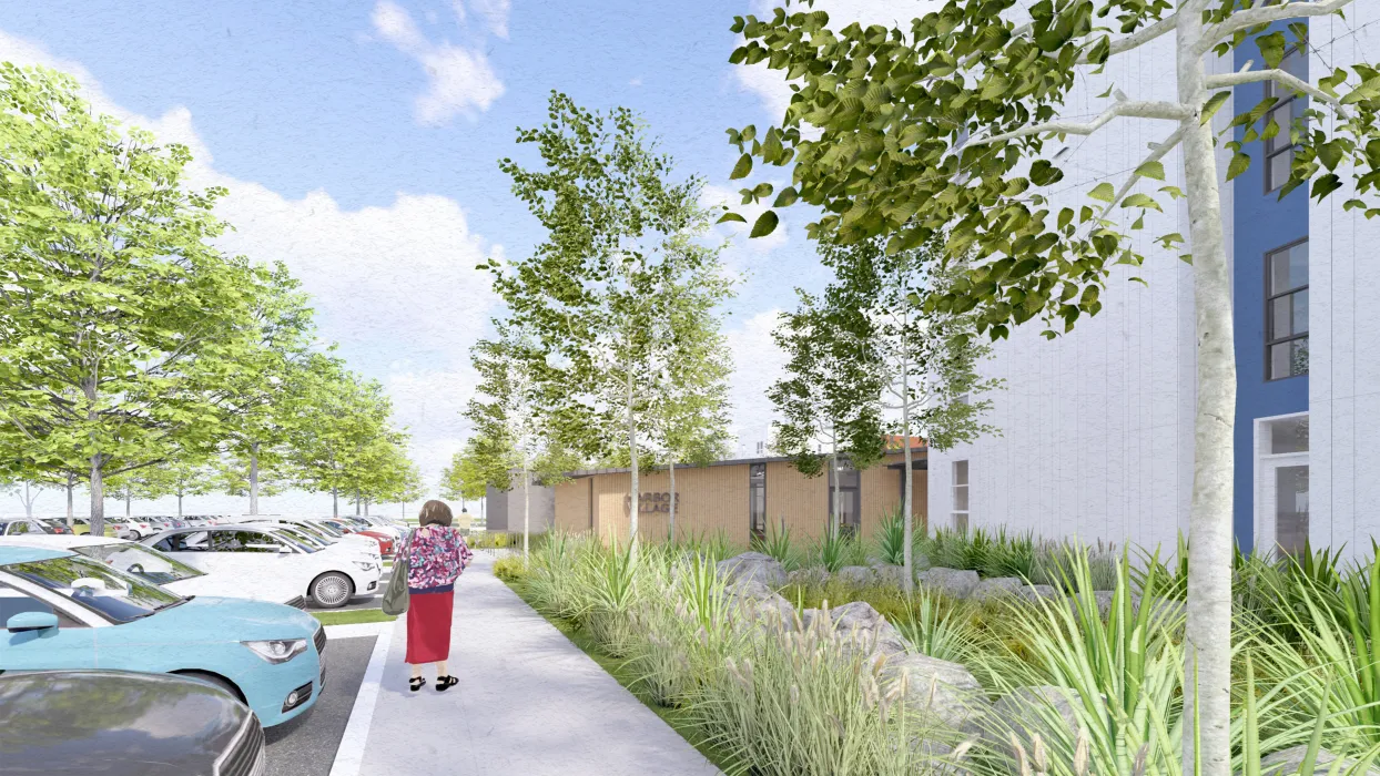 Woman walking on sidewalk with white building on the right 