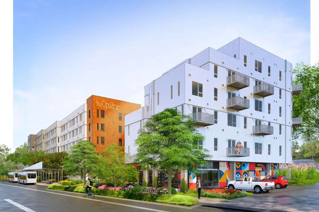 White building in foreground with orange in the background